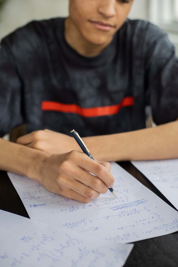image of person doing math problems
