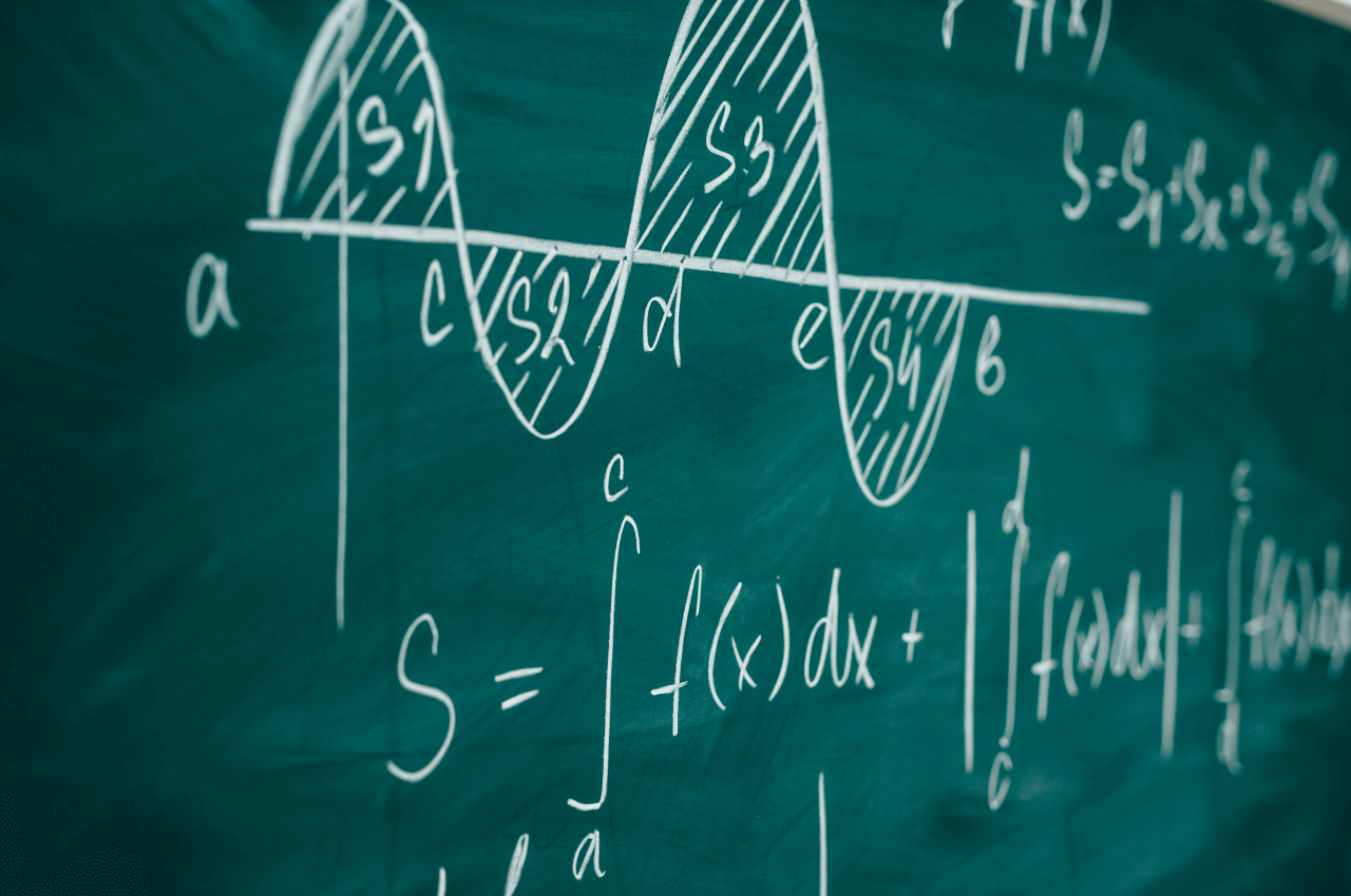 The image shows a calculus equation written on a dry erase board.